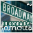 Green street sign reading 'BROADWAY' with white text on a blue background, below which is green text reading 'IM GONNA BE' in pixelated font.