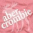 Pixelated pink background with white text reading 'glamorous' in a cursive font, partially obscured by pixelation.