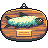 Pixel art of a fish in a wooden bowl with a hanging loop, featuring a light blue and white body, green fins, and a yellow rectangular label.