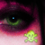 A close-up of a green eye with pink and purple eyeshadow, featuring three distinct pixelated symbols: a yellow skull, a yellow star, and a pink heart.