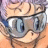A 48x48 pixel animated buddy icon featuring a cartoon character with light brown hair and blue goggles, alongside text reading "Anime IM" and "COM" on a black background.