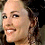 A 50x50 pixel animated contact sheet showing two frames of a buddy icon with a woman's face on the left and green text reading "Original Icons .com" on the right against a dark background.