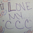A four- with pixelated text and symbols on pink, gray, and white backgrounds