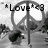 A grayscale pixelated image shows a stylized bicycle with the word 'Love' in block letters above it, set against a light background.