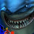 Pixelated static image of a large shark mouth with sharp teeth against blue water background, featuring small colorful elements at bottom left corner.