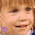 A 4x4 contact sheet of animated frames featuring a child's face with changing text overlays and heart symbols, each frame displaying variations in text color, wording, and heart icon style against a gray background.