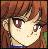 Pixelated anime-style face with brown hair, large dark eyes, and a slight smile against a reddish-brown background.
