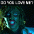 Pixelated image with text "DO YOU LOVE ME?" above a dark, abstract face-like figure with glowing blue eyes and greenish hues.