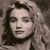 Static grayscale buddy icon of a person with long wavy hair, closed eyes, and neutral expression in low-resolution pixel art style.