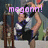 Pixelated image of a person in motion with raised arm, wearing dark shorts and white top, standing near wooden structure under pink text reading 'mgaann!' on blurred background.