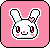 Pixelated bunny head with pink bow on left ear, red eyes, and blush marks against solid pink background.