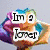 A colorful, pixelated image of a character with a flower-like head, displaying text in multiple colors and styles across four