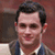 Pixelated image of a person with dark hair and light skin wearing a blue jacket over a white shirt, next to text reading "Where's My Humphrey?" on a red background.