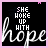 Black background with white and pink text reading "SHE WOKE UP WITH" above large cursive "hope" in light purple, scattered small pink stars.