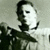 Black-and-white animated sequence showing a figure with a white mask holding a dark curved blade, shifting from left to right