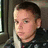 A static image shows a person with short dark hair in a vehicle interior, next to pixelated text reading "shane linbon is my love <8" and "nothing can explain how much i love him." A small heart symbol appears above the right text block.