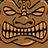 Pixelated brown tiki face icon with closed eyes, wide mouth showing teeth, and raised arms in a static single-frame image.