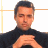 A 48x48 pixel buddy icon split into two frames showing a person in dark clothing on the left and green text logo on the right against a white background.
