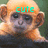 Pixelated image of a monkey with light brown fur and dark eyes, overlaid with cyan text reading 'cute' above its head.