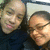 Two pixelated faces in close proximity, one with light skin and closed eyes, the other with darker hair and a neutral expression.