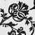 Black and white pixelated icon with stylized floral or vine-like shapes surrounding a central circular design, set against a transparent background.