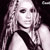 Pixelated grayscale image of a person with long hair holding a microphone against a dark background.