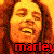 Pixelated static image of a person's face with red text at the bottom, rendered in warm orange and yellow tones on a dark brown background.