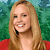 A pixelated image shows a smiling woman with long blonde hair wearing a red top against a green background with 'CAMP ROCK' text.