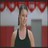 Pixelated static image of a person in dark tank top against red and gray background with light blue accents.