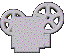 A silver film reel icon with two reels, showing animation frames where the left reel's holes change from pink dots to yellow highlights and a black background appears.