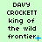 Pixelated text reads 'DAVY CROCKETT king of the wild frontier' on a light green background with blue star and dot animations.