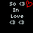 A pixelated image displays 'So <3 In Love' with two heart symbols, where the rightmost heart is red and animated to pulse.