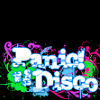 Pixelated text 'Panic! at the Disco' in white with blue outlines, surrounded by green and pink splatter effects on a black background.