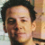 Static 50x50 pixel buddy icon showing a close-up of a person's face with dark hair and light skin, rendered in low-resolution pixel art style.