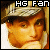 Pixelated image of a person wearing a cap with visible text 'HG Fan' above the head, rendered in warm tones.
