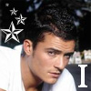 A person with dark hair wearing a white shirt, with three white stars and a large white 'I' on the image.
