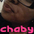 Pixelated close-up of a person's face with closed eyes and a dark top, overlaid with bright pink text reading 'chaby' at the bottom.