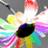 A pixelated image of a colorful, abstract flower-like shape with a black center on a gray background, accompanied by pink text on a black background.