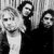 A contact sheet of two animated frames showing a black-and-white photo of three people on the left and a yellow Nirvana logo with smiley face on the right.