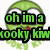 Green cartoon character with large white eyes and red mouth, overlaid with pixelated text in green or cyan colors.