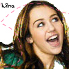 A static image of a person with long brown hair wearing a green and white top, with pink dashed lines radiating from the top-left corner.