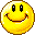 Pixelated yellow circular faces with black eyes and brown mouths in various smiling expressions arranged in a