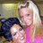 Two people in close proximity; one with dark hair and the other with light hair wearing a pink top, set against a blurred background.