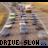 A 4-frame animated contact sheet showing a road intersection with vehicles and text overlays, where the top row displays "DRIVE SLOW.. GET NOWHERE" and the bottom row shows "DRIVE FAST.. GET THERE", with visible vehicle movement across frames.