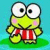 Pixelated cartoon frog character with large eyes, pink cheeks, and red striped shorts standing on green grass against a blue background.