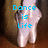 A pixelated image of a person's lower legs and feet in white ballet shoes against a brown background, with blue text reading "Dance is Life" on the left and "la danse est la vie" on the right.