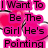 A static image with pink text on a white background featuring heart shapes and the phrase "I Want To Be The Girl He's Pointing" followed by "He's Whispering To His Friends" and "'THAT'S HER!'"