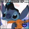 Stitch from Lilo & Stitch holds an orange guitar, wears white clothing, and has a heart symbol near his hand; text above reads "I'M ALL SHOOK UP..." with blue lettering.