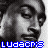 A 3x3 contact sheet of a black-and-white animated icon featuring repeated facial expressions and blue pixelated text "LUDACRIS" across nine frames.