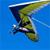 Static pixelated icon of a flying figure with green wings against blue background, appearing to be in motion with trailing lines.